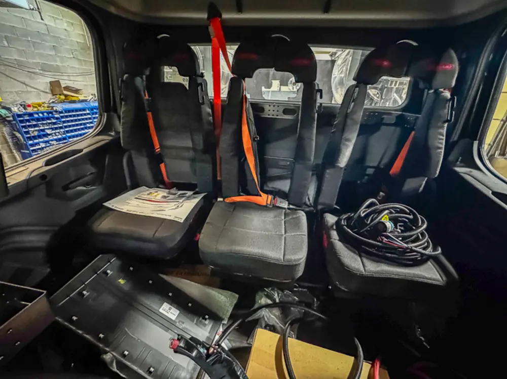 Apparatus in production bay with hood open, photo 101 of 303.